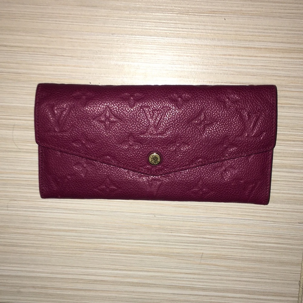like new Loui Vuitton red wallet